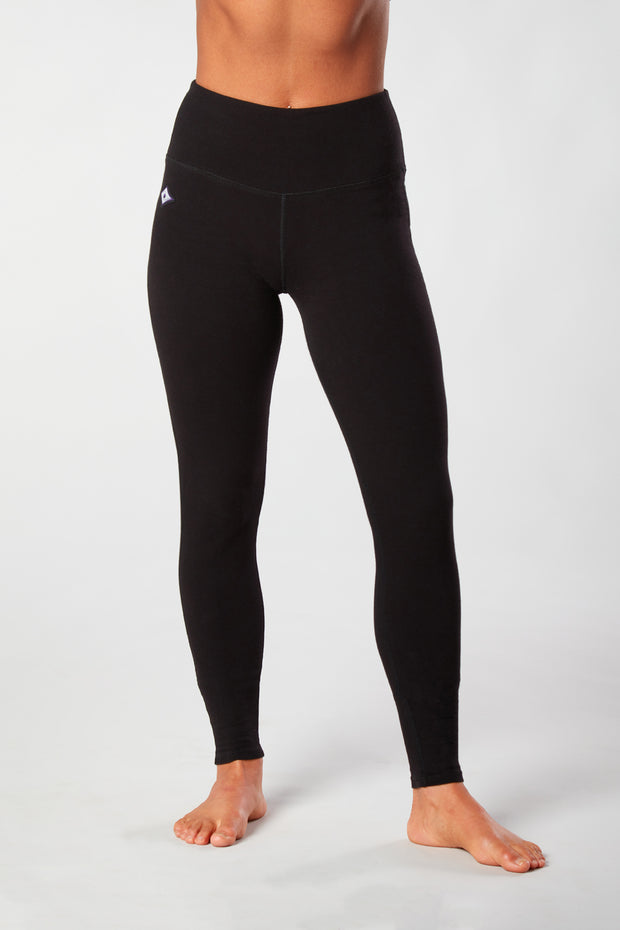 Woman's legs showing pair of black organic cotton Luana Legging yoga pants