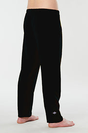 Man standing back turned facing right wearing black color organic cotton yoga Mana Pants 