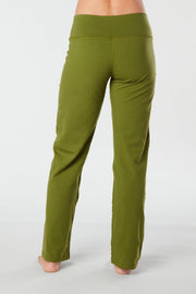 Woman's back facing legs showing pair of lime green organic cotton Luana Pants yoga pants