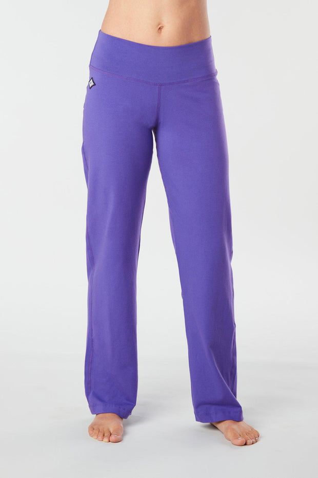 Woman's forward facing legs showing pair of purple colored organic cotton Luana Pants
