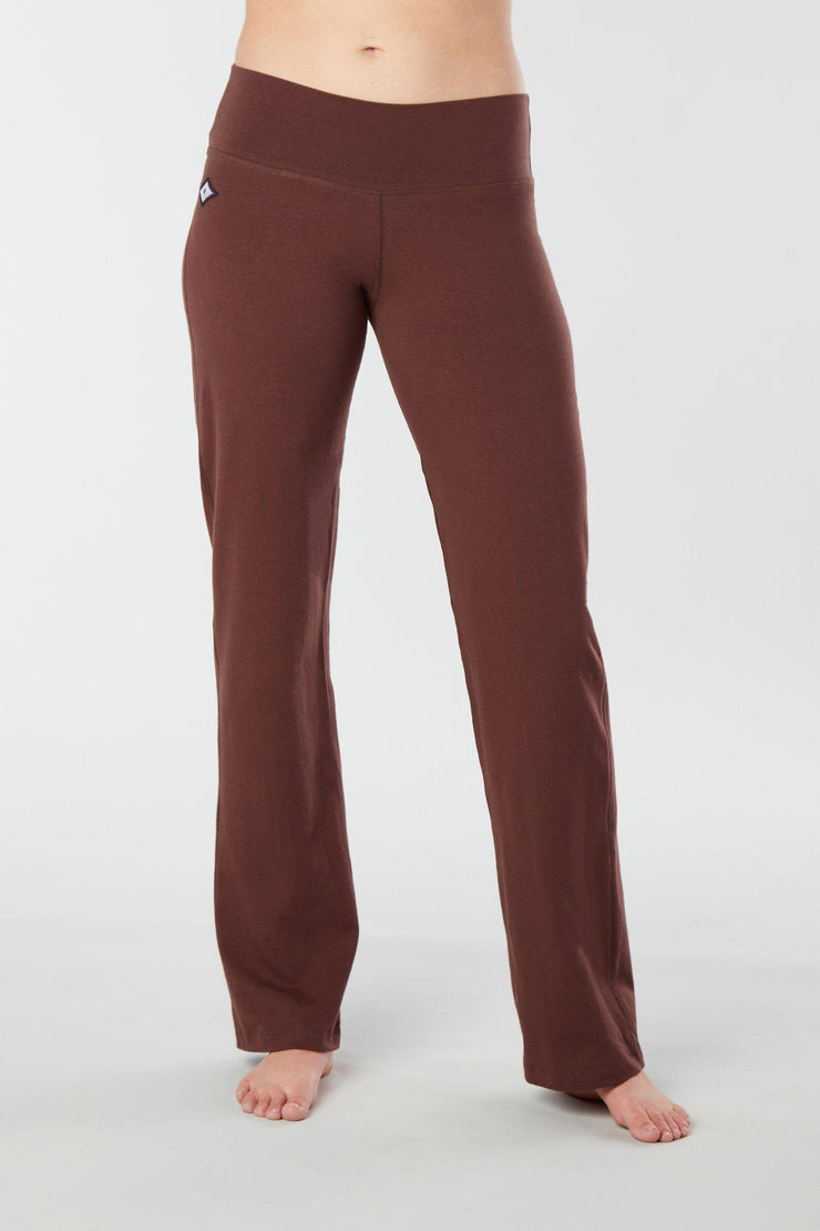 Woman's forward facing legs showing pair of brown organic cotton Luana Pants yoga pants
