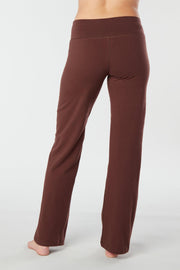 Woman's back facing legs showing pair of brown organic cotton Luana Pants yoga pants