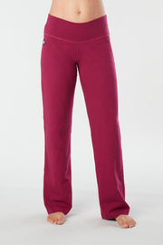 Woman's side facing legs showing pair of rose colored organic cotton Luana Pants yoga pants