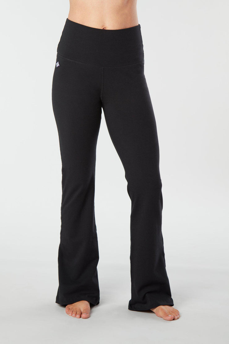 Woman's lower half facing forward wearing black colored organic cotton Moana Yoga Pants