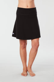 Front view of a woman wearing an black Kahe Skirt 