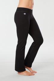 Women lower body showing legs and feet facing sideways wearing black colored organic cotton Pono yoga pants