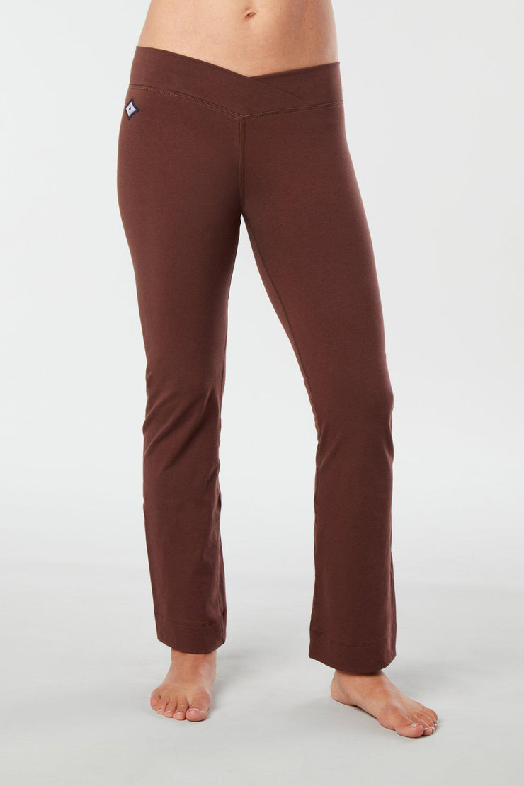Women lower body showing legs and feet facing forward wearing brown colored organic cotton Pono yoga pants