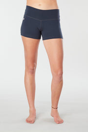 Woman legs forward facing wearing matching navy blue colored organic cotton Luana Shorts 
