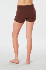 Woman legs back facing wearing matching brown colored organic cotton Luana Shorts 