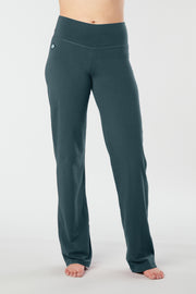 Woman's forward facing legs showing pair of green organic cotton Luana Pants yoga pants