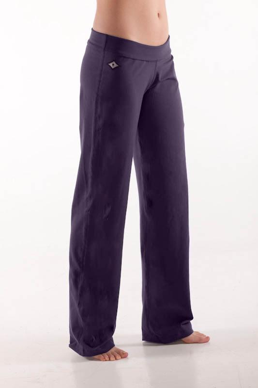 Woman's side facing legs showing pair of dark purple colored organic cotton Luana Pants yoga pants