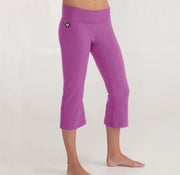 Woman's lower half facing sideways of her body showing pink colored organic cotton Moana Capri yoga pants