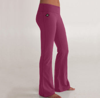 Woman's lower half facing sideways wearing purple colored organic cotton Moana Yoga Pants